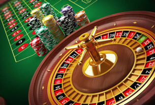 Roulette wheel and casino chips on the table.Similar images: